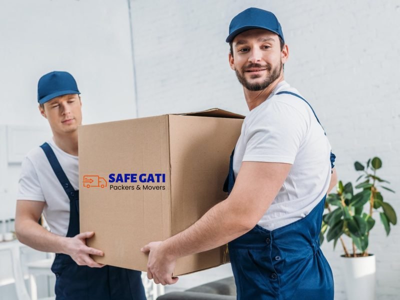 two-handsome-movers-transporting-cardboard-box-in-apartment copy